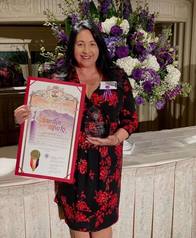 Picture of Marilyn receiving the honor of Woman of the Year by Los Angeles County and the Commission of Women in March 2020